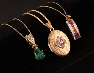 A ruby and diamond set locket in