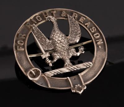 A Scottish white metal clan badge,