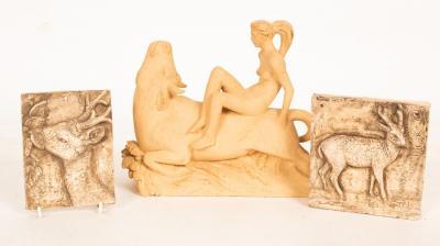 A pottery figure of a nude on the