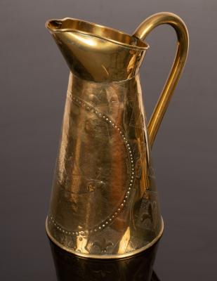 A large brass ewer decorated fish, birds