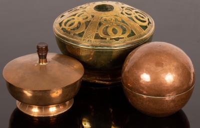 A spherical copper string box, etched