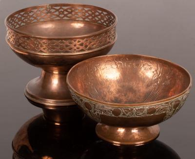A copper pedestal bowl with pierced