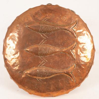 A Newlyn School copper shield embossed