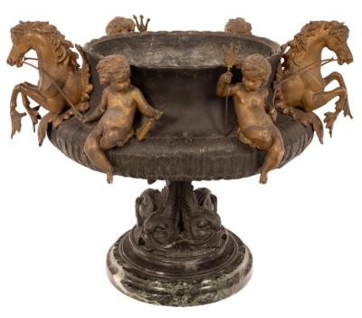 A metal jardinière with applied cherubs