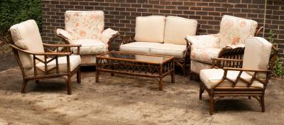 A wicker garden furniture suite with