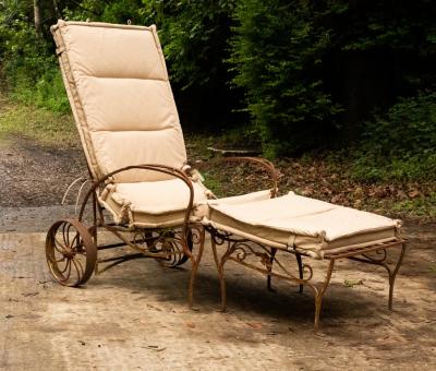 An iron framed deck chair with adjustable