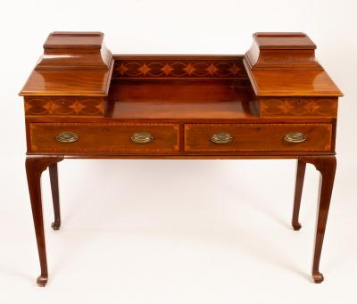 An Edwardian mahogany table with drawers