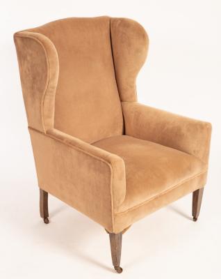 A wing back armchair on square