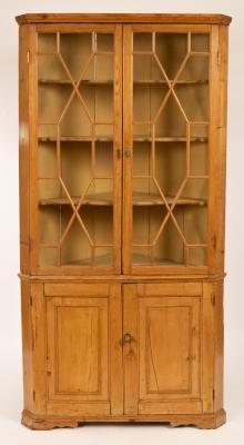 A pine corner cupboard with twin 279762