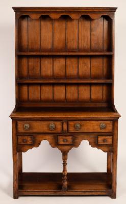 A small oak dresser with shelves over,