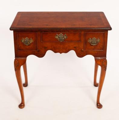 A burr yew kneehole table with 27977a
