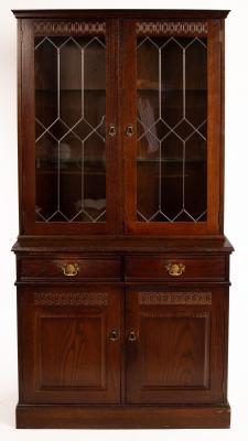 An oak display case with cupboards