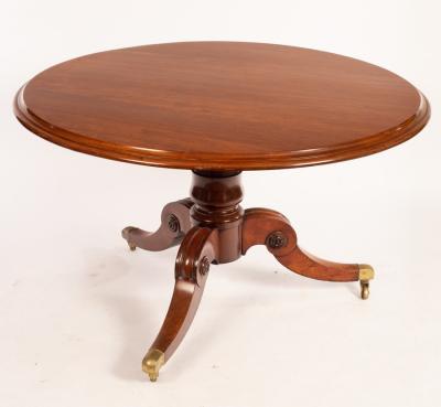 A Victorian mahogany circular dining