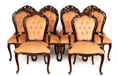 A set of ten dining chairs with scrolling