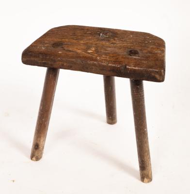 An oak dairy stool, 40cm high