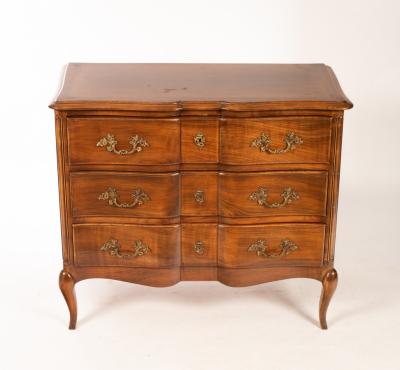 A French walnut commode, the serpentine