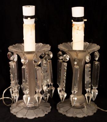 A pair of clear glass lustres hung