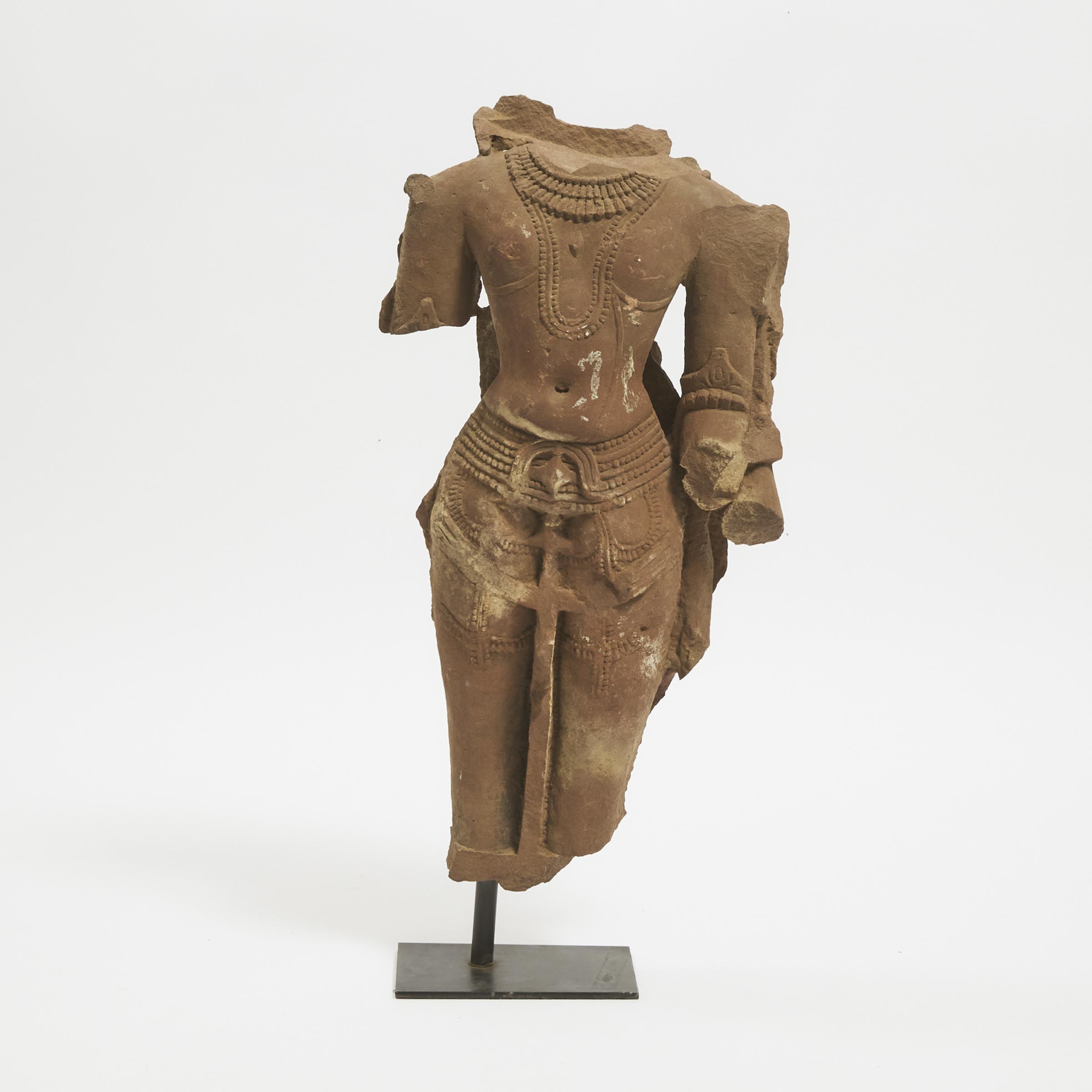 A Large Stone Torso of a Male Deity,