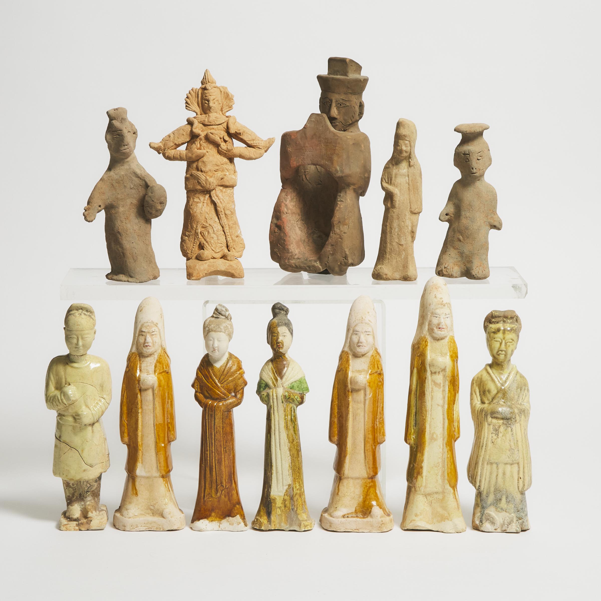 A Group of Twelve Pottery Figures,