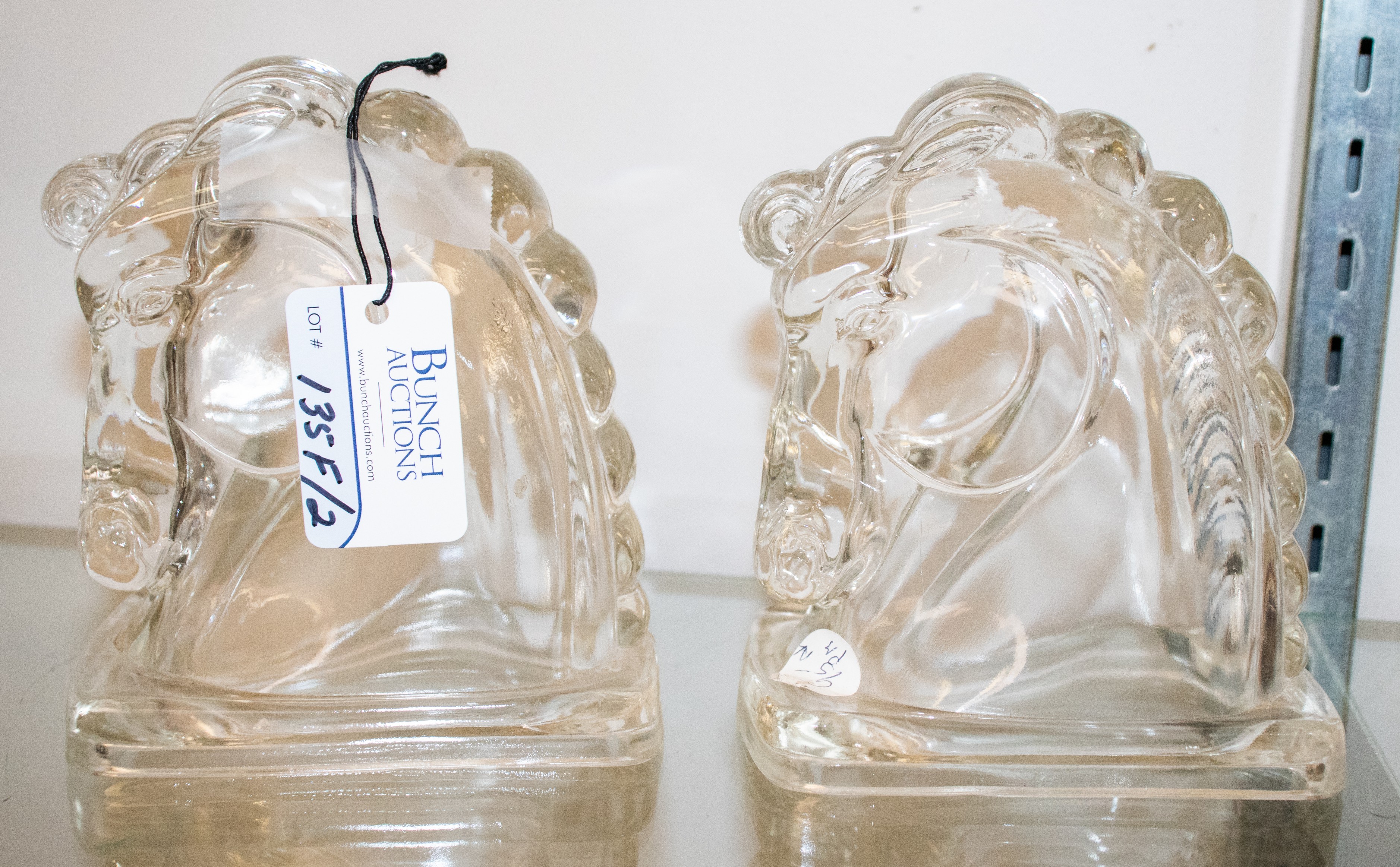 Pair of glass horse head bookends,