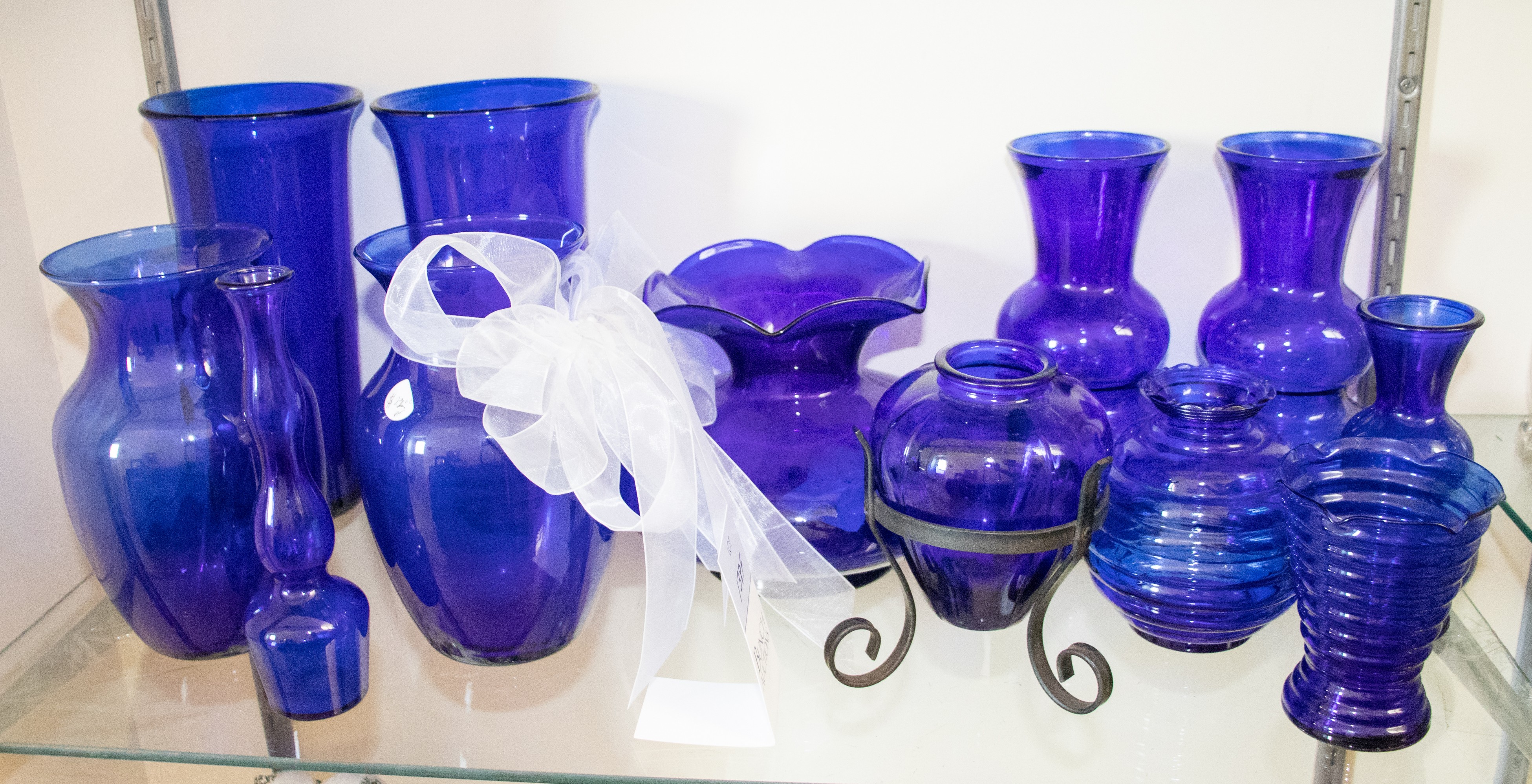 (12) Blue glass vases, tallest 10