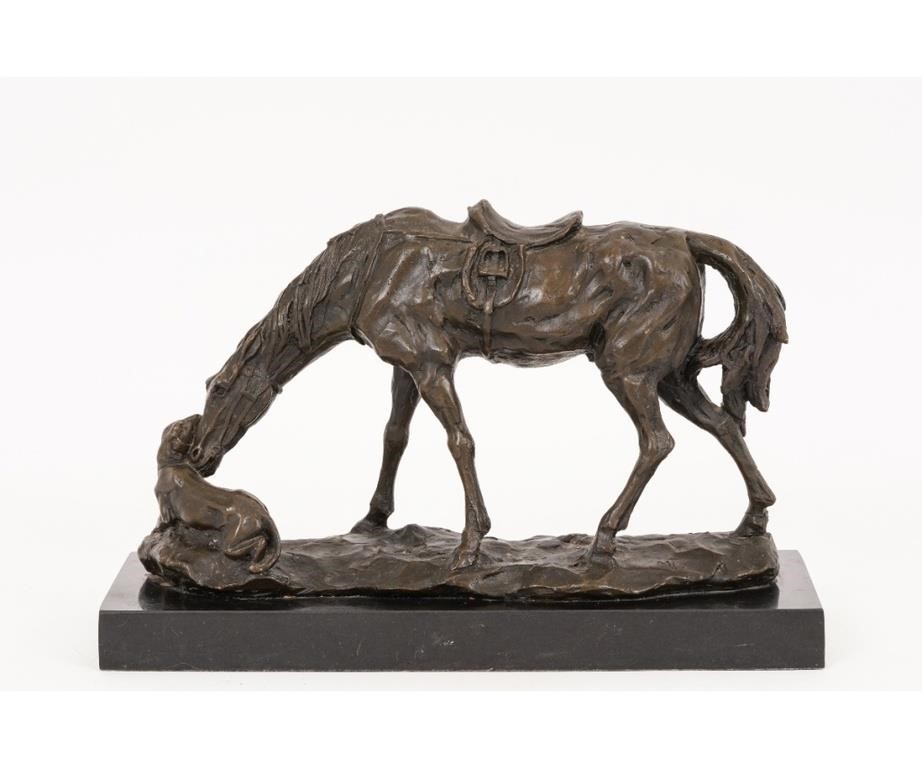 Bronze saddled horse and mountain