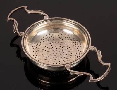 A two-handled silver tea strainer, Sheffield