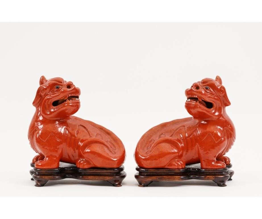 Pair of Chinese red porcelain seated