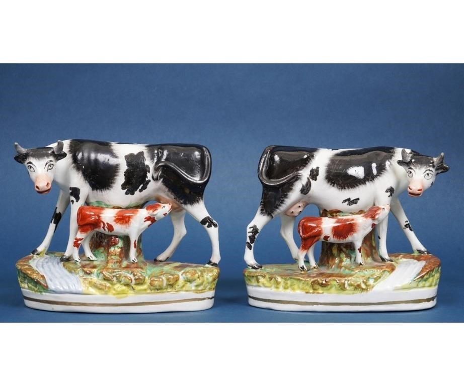Pair of Staffordshire cows with