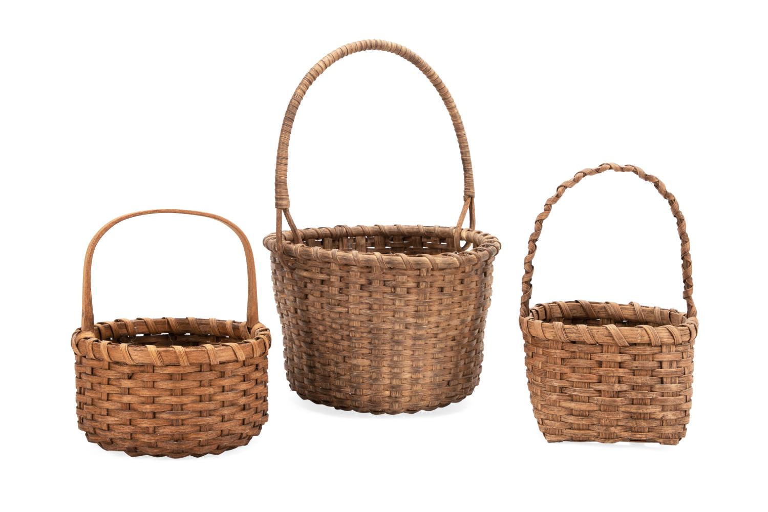 THREE HANDWOVEN REED BASKETS W/
