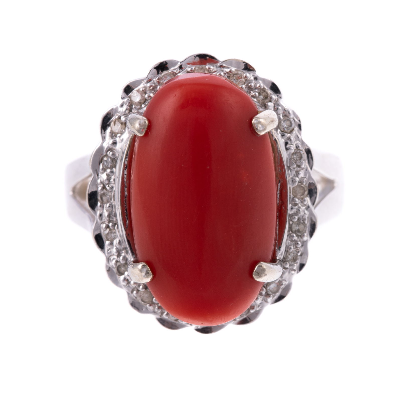 AN OVAL CORAL & DIAMOND RING IN