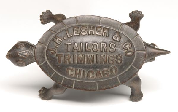 AN IRON TURTLE ADVERTISING MATCH