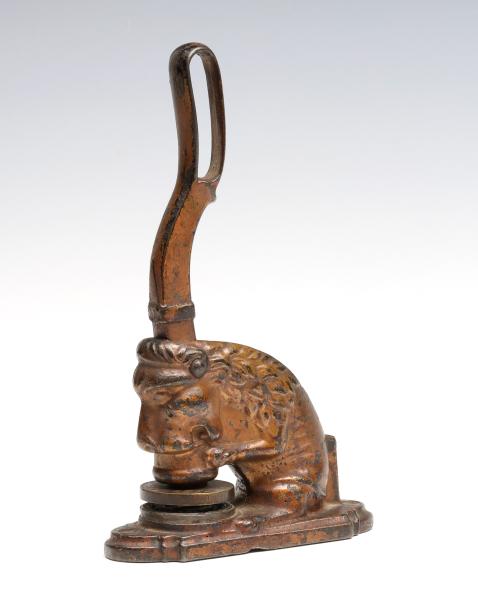 A LARGE FIGURAL SEATED LION IRON 289004