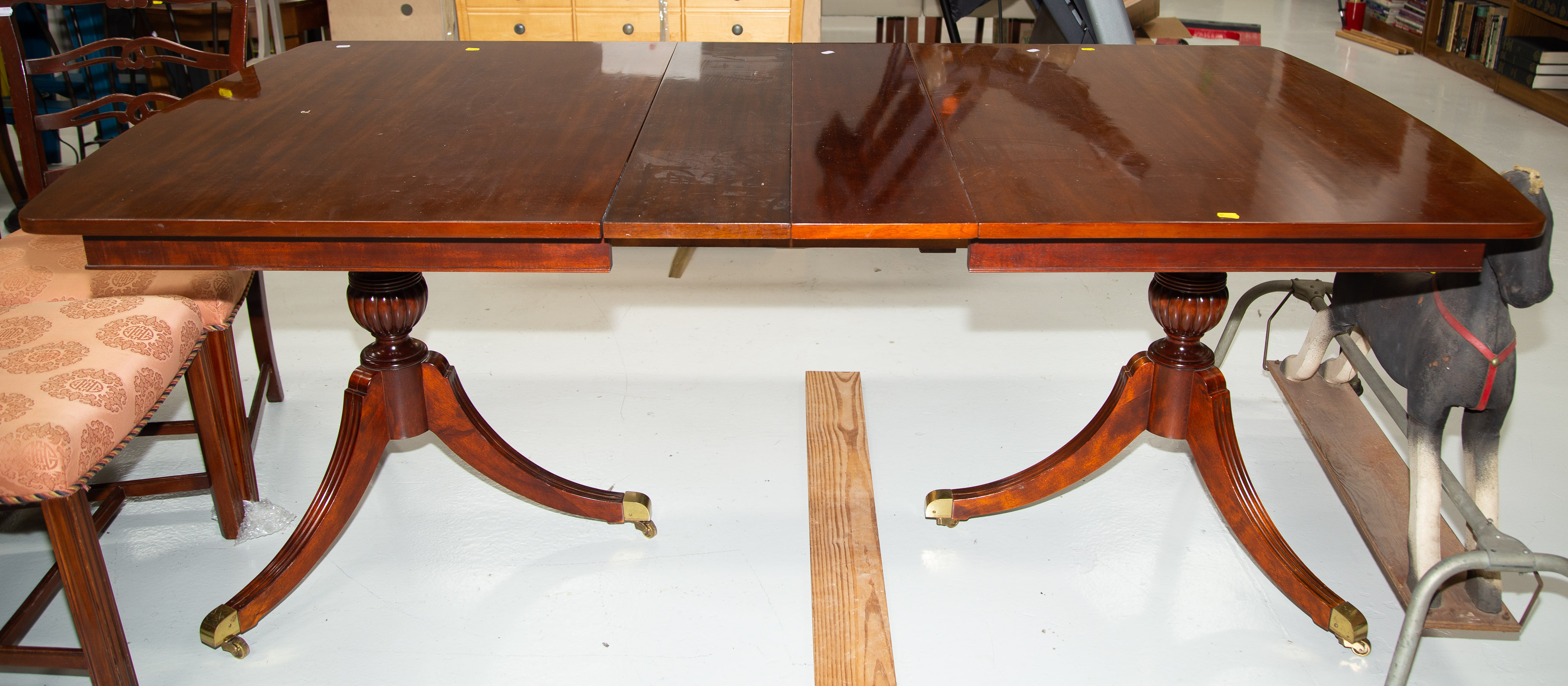 MAHOGANY DINING TABLE With two leaves.