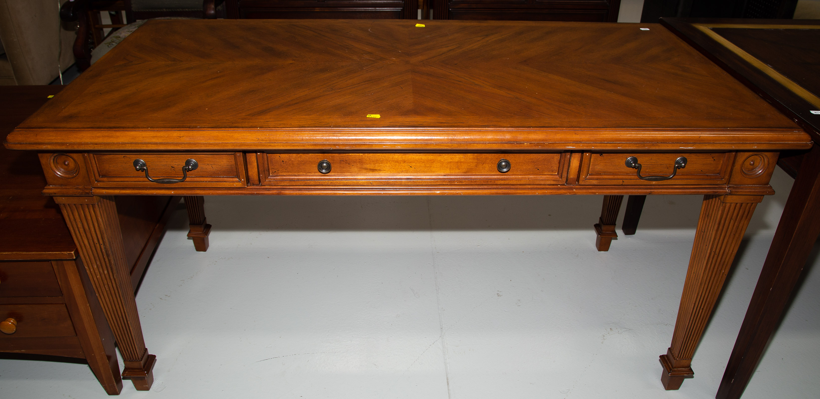 A THREE-DRAWER LIBRARY TABLE 30 1/2