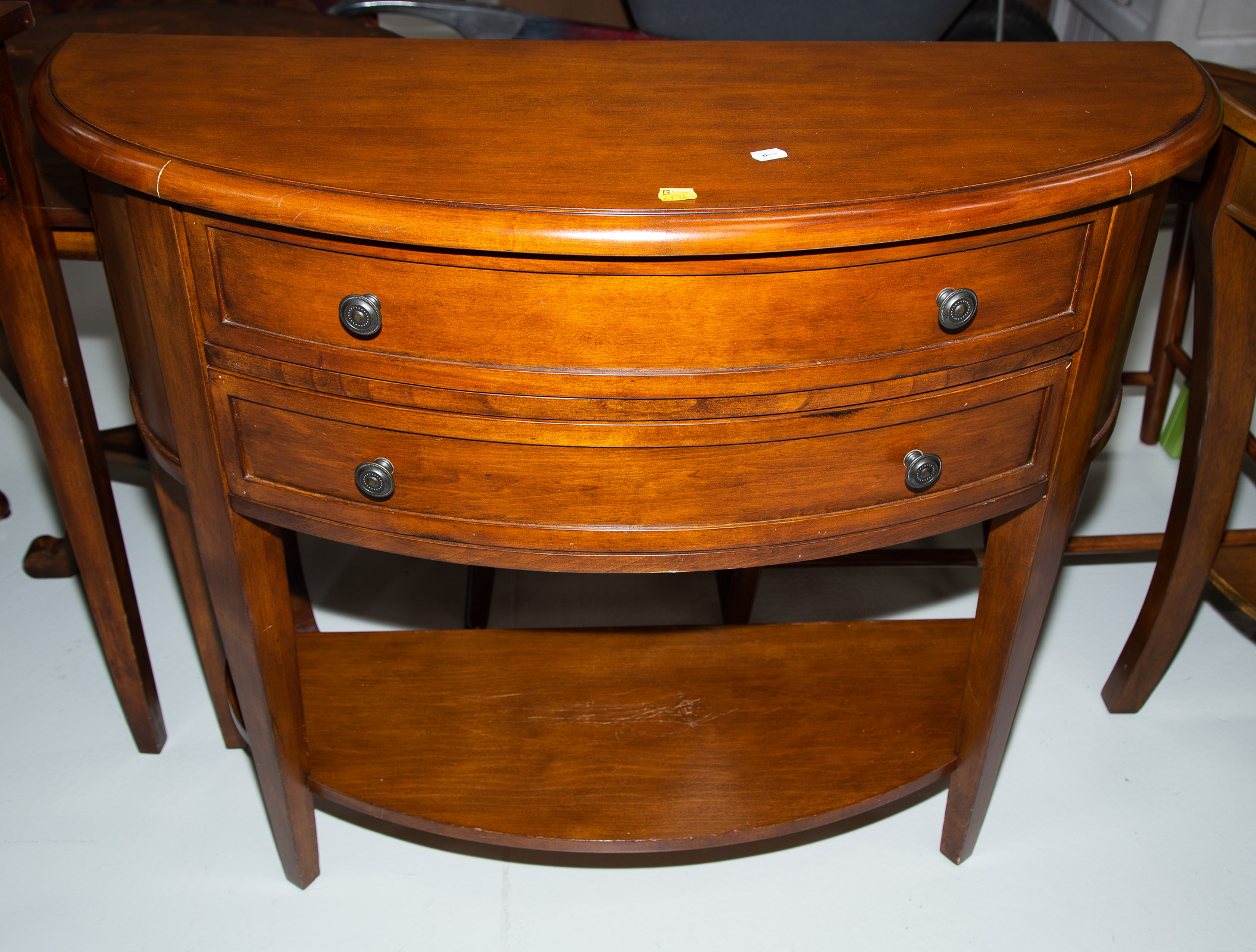 A TWO-DRAWER DEMILUNE CONSOLE TABLE