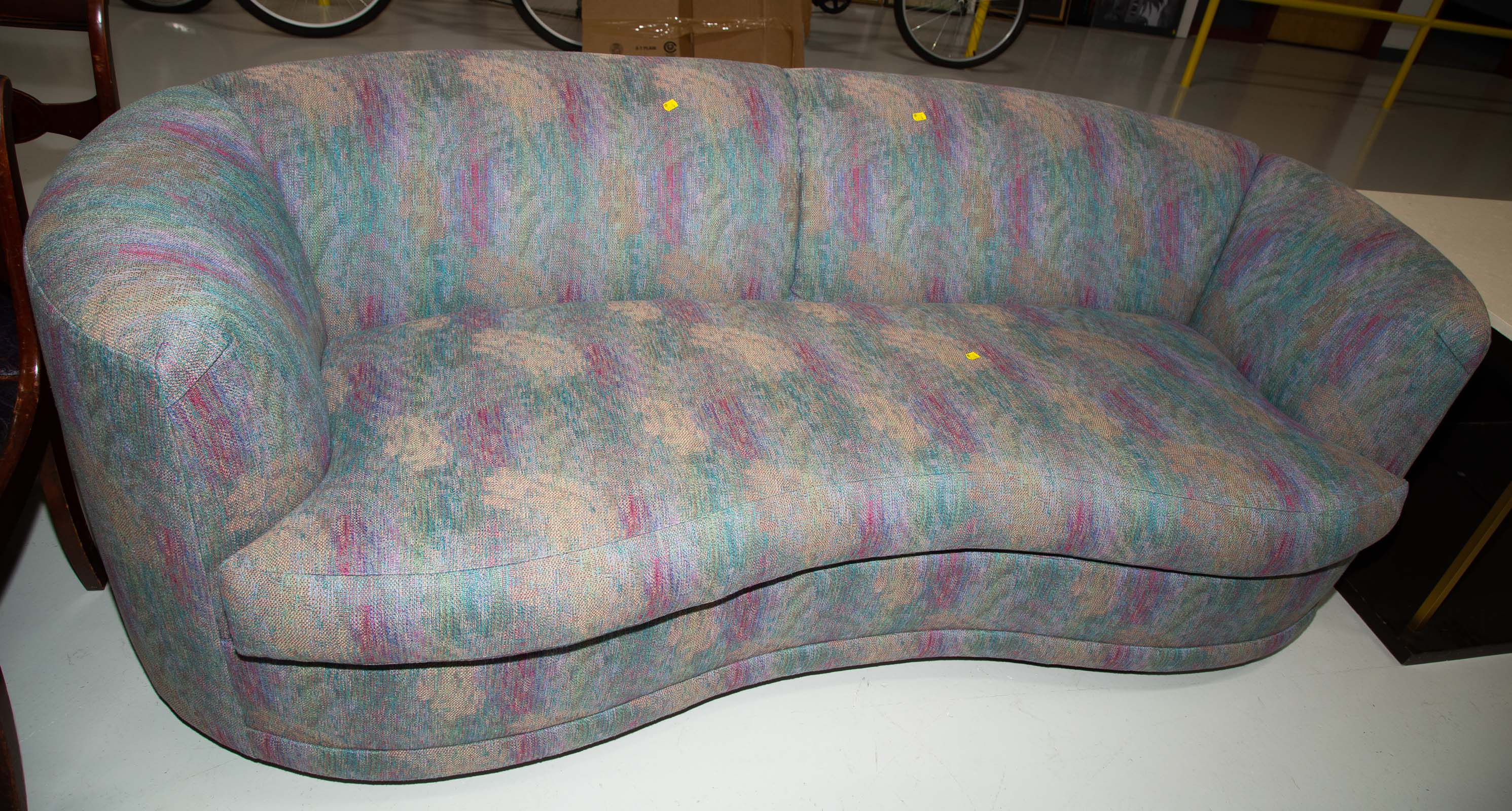 A MODERN UPHOLSTERED SOFA With two matching