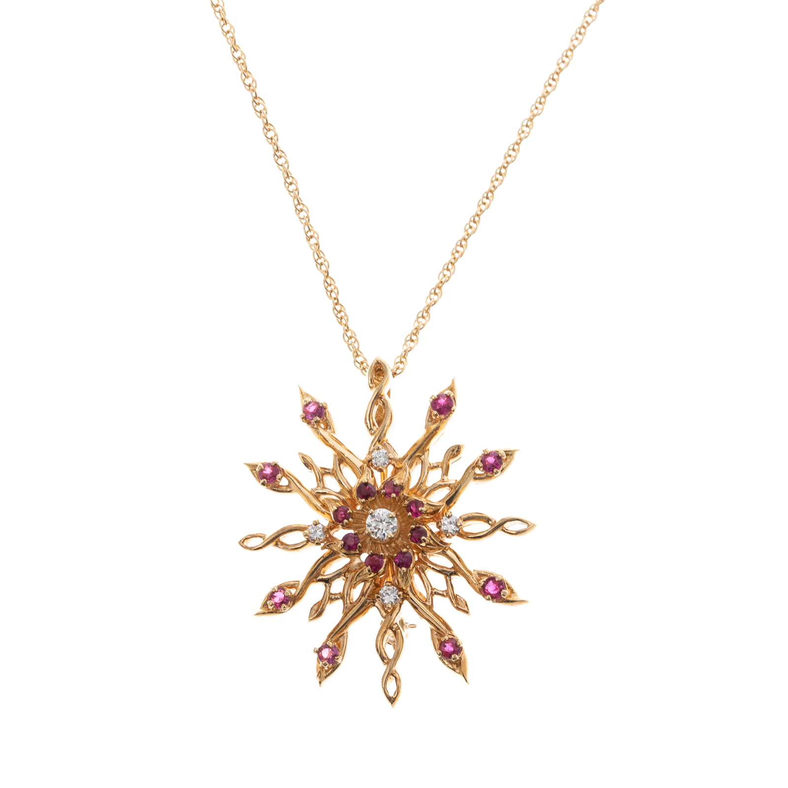 A RUBY & DIAMOND STARBURST PIN/PENDANT