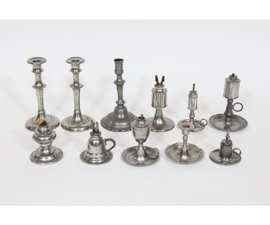 Eleven pieces of pewter lighting,