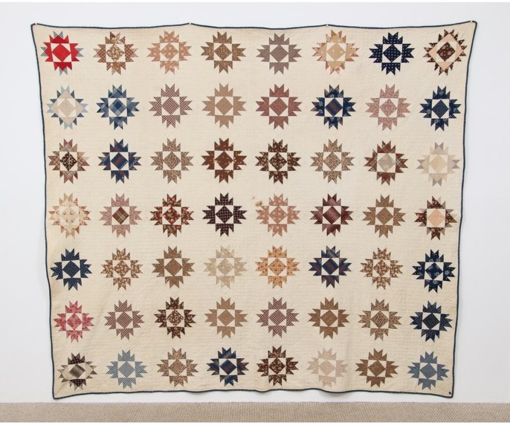 Pieced quilt in colorful snowflake 28a726