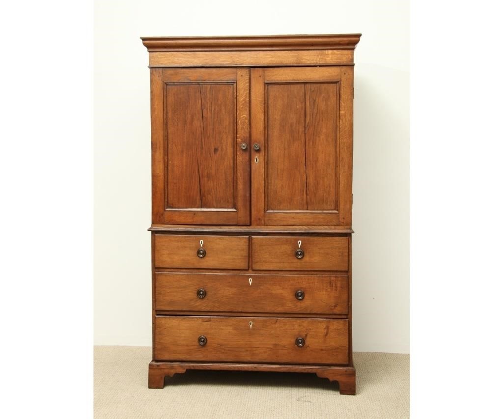 Georgian oak two-piece linen press,