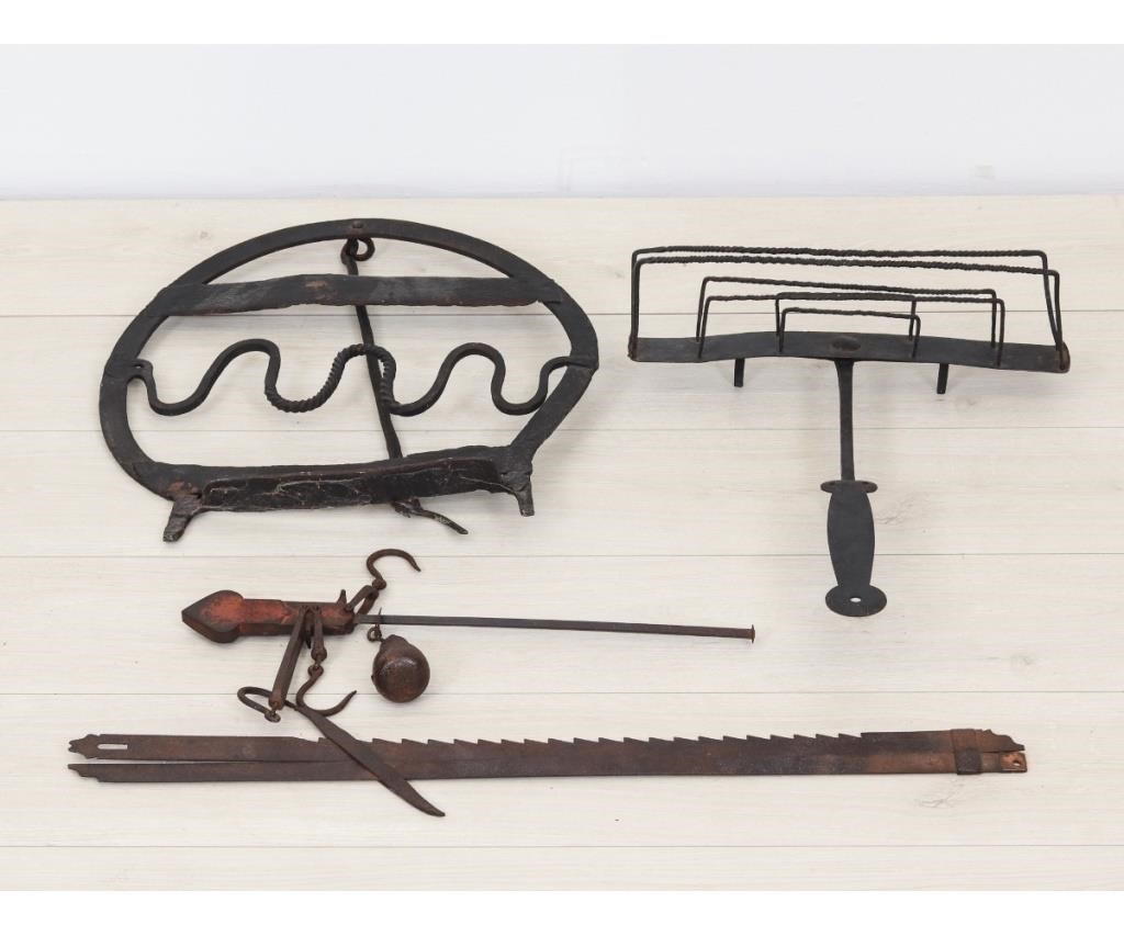 Early wrought iron toaster, scale and