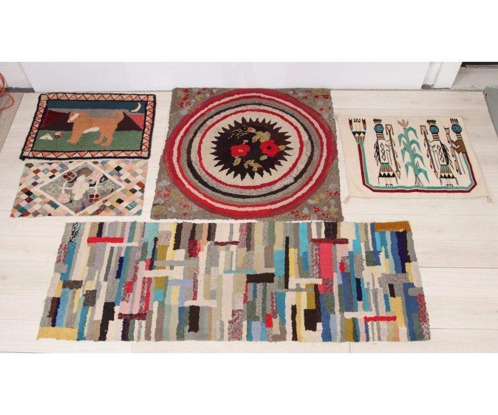 Four hooked rugs to include a rectangular 28a865