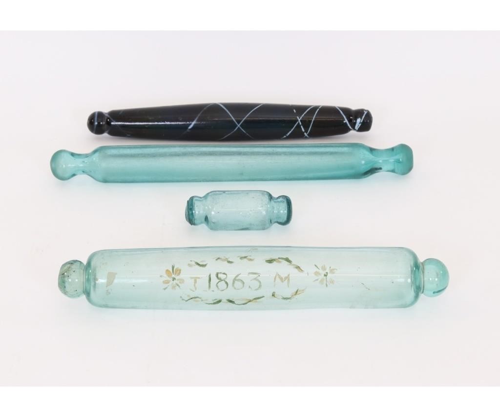 Four vintage glass rolling pins, the