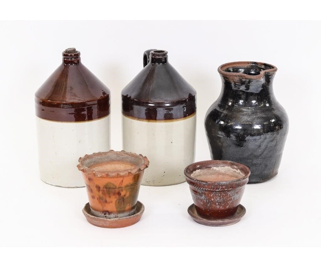 Redware pitcher, two flower pots, and