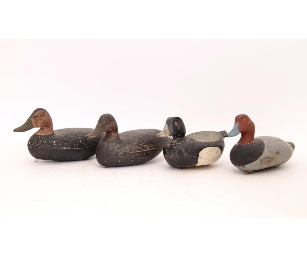 Four carved duck decoys to include 28a95b