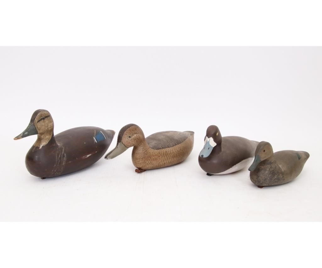 Four duck decoys to include a green