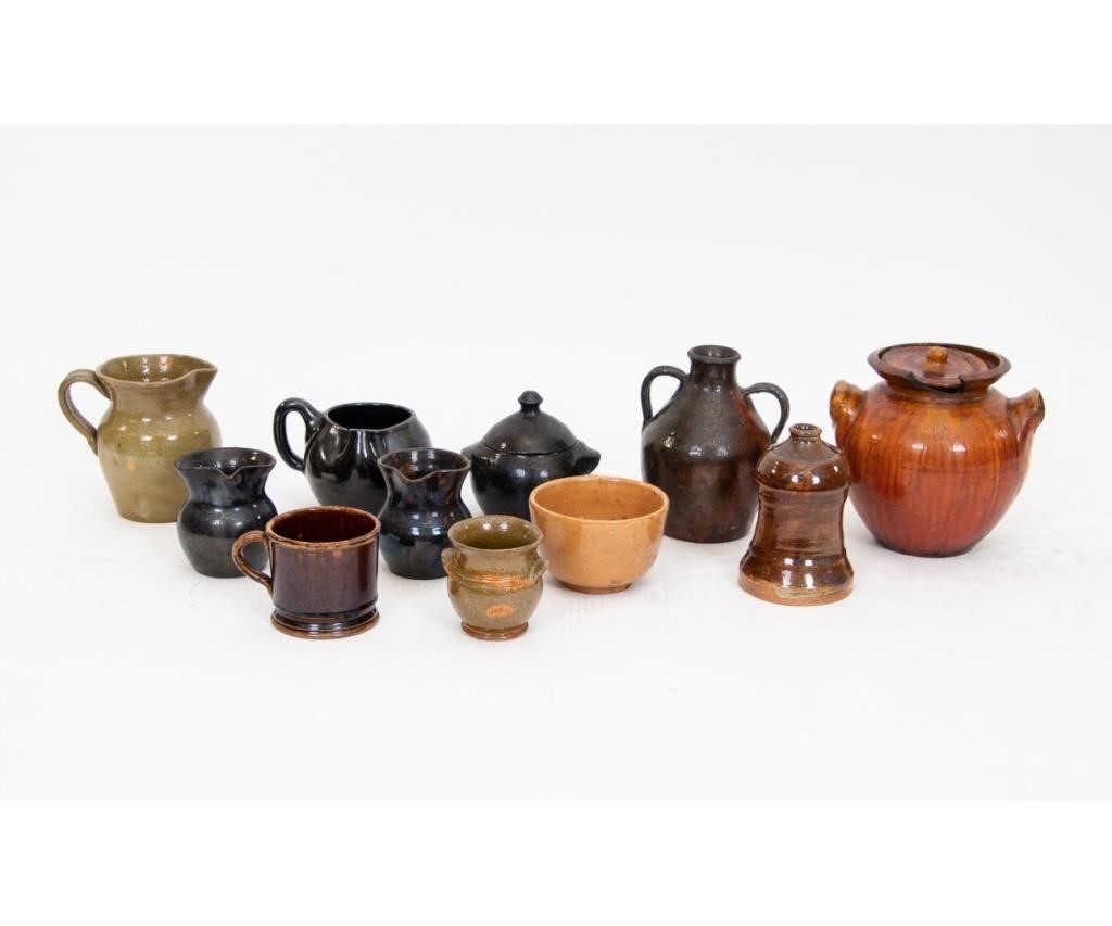 Eleven redware table pieces some