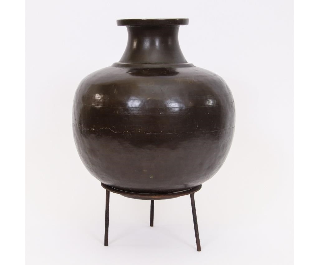 Hand hammered brass urn on a wrought 28aba0