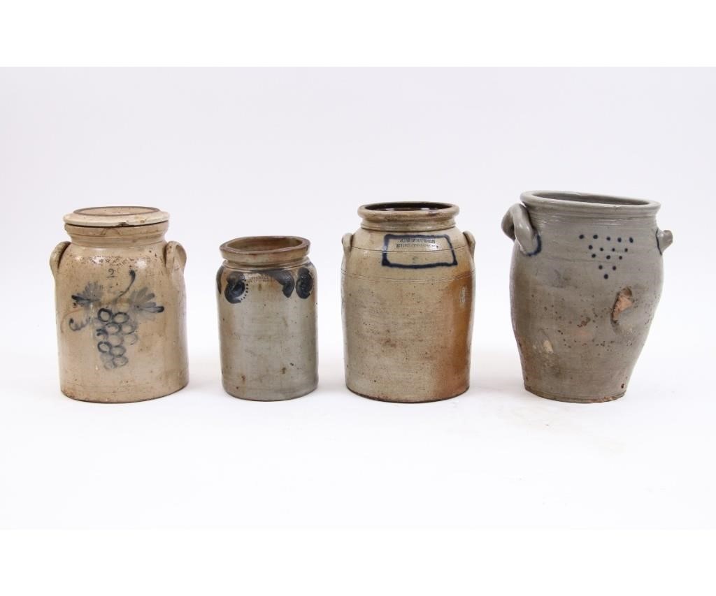 Four stoneware crocks include a